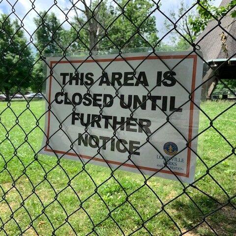 Sign warning that Hogan's Fountain Pavilion in Cherokee Park is closed (in May 2022)